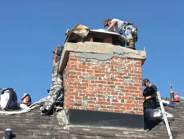 Jacksonville Chimney Sweep installing a custom chimney crown in Jacksonville, FL