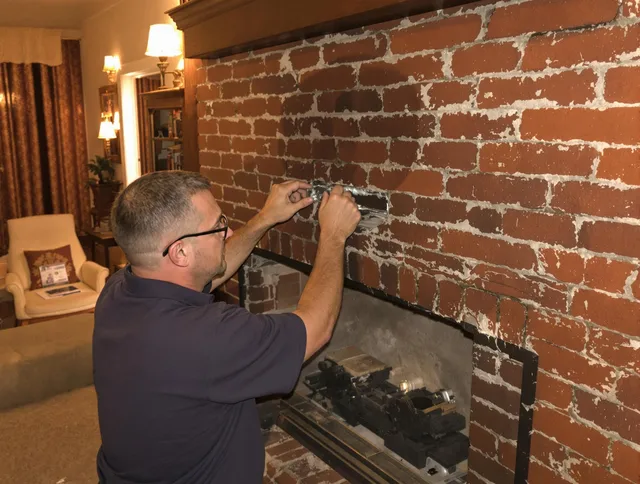 Jacksonville Chimney Sweep expert fixing a fireplace in Jacksonville, FL